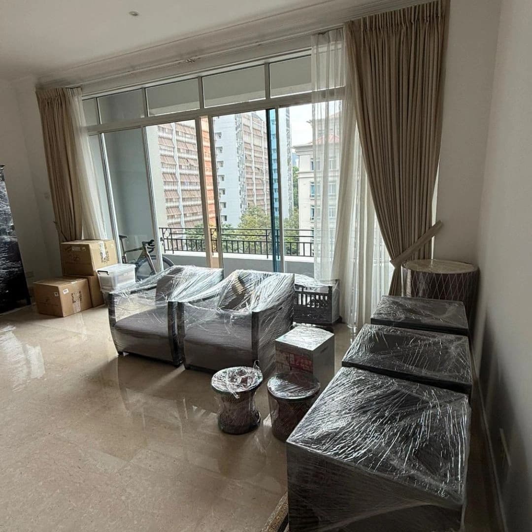 Wrapped chairs and household furniture ready for a Singapore condo move