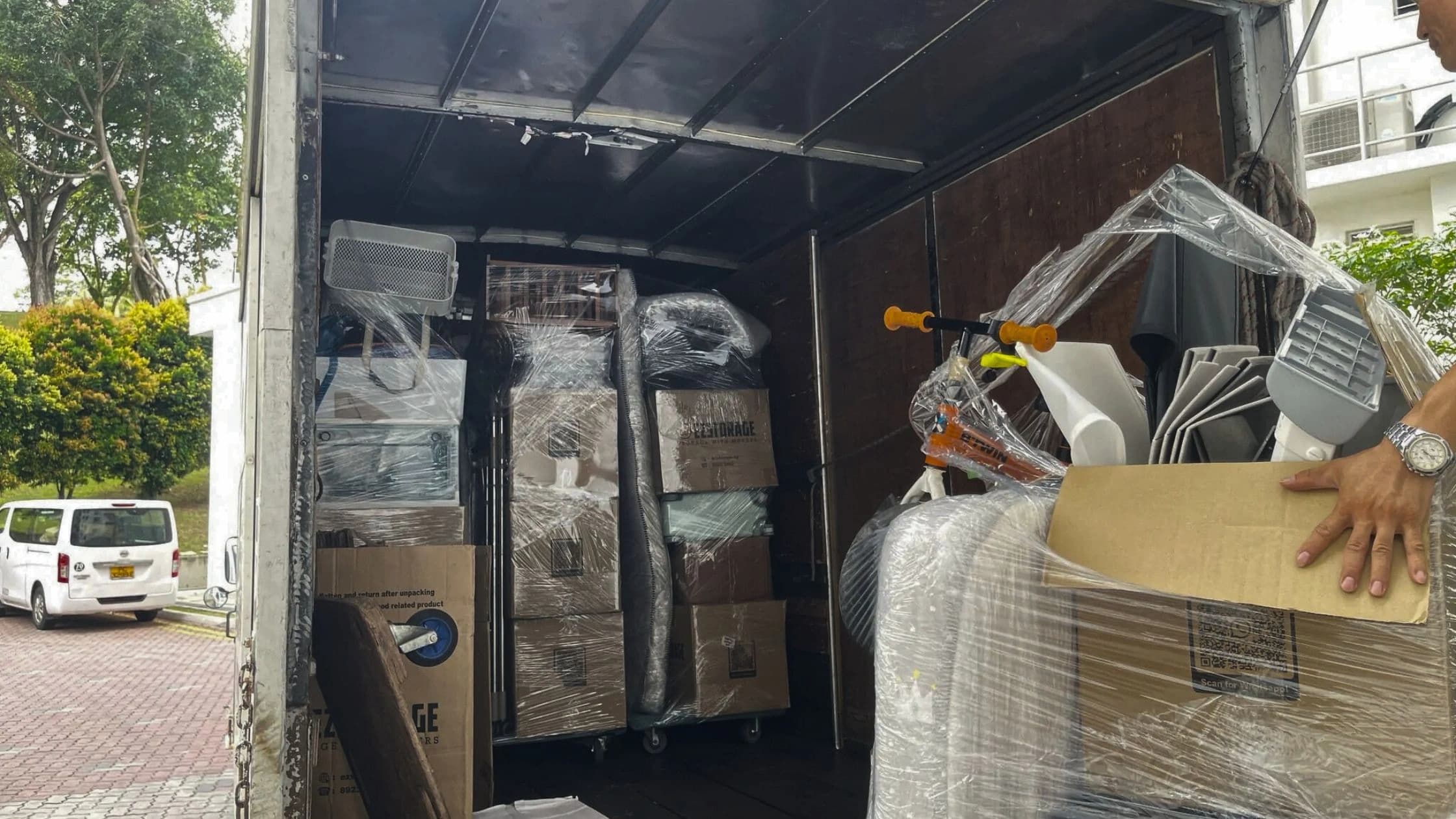 Furniture and cartons organised in a moving truck